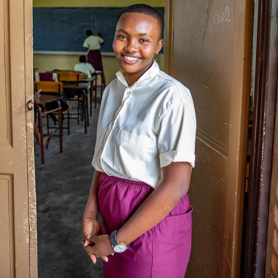 91862_SOS-KD_Burundi_Chrisse Carelle in front of her classroom.jpg