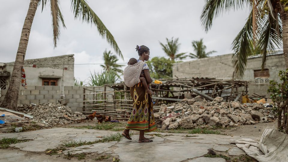 49343_Mozambique_ERP_Beira_ Cornel van Heerden_Luisa walking on what is left of her destroyed house_adam_301223_23112019.JPG